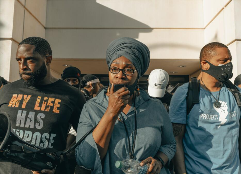 Drei Amerikaner auf einer Demonstration
