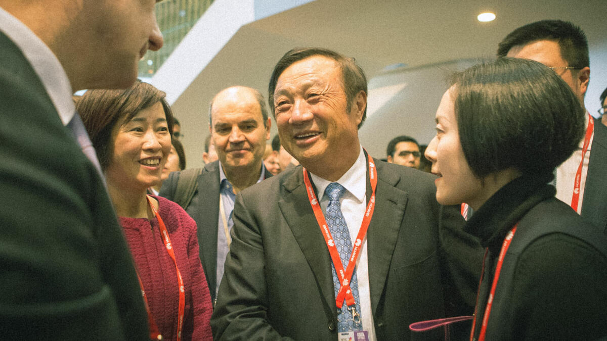 Huawei founder Ren Zhengfei (centre) likes to resort to military metaphors to motivate his employees