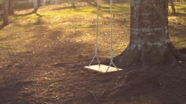 Empty wooden swing