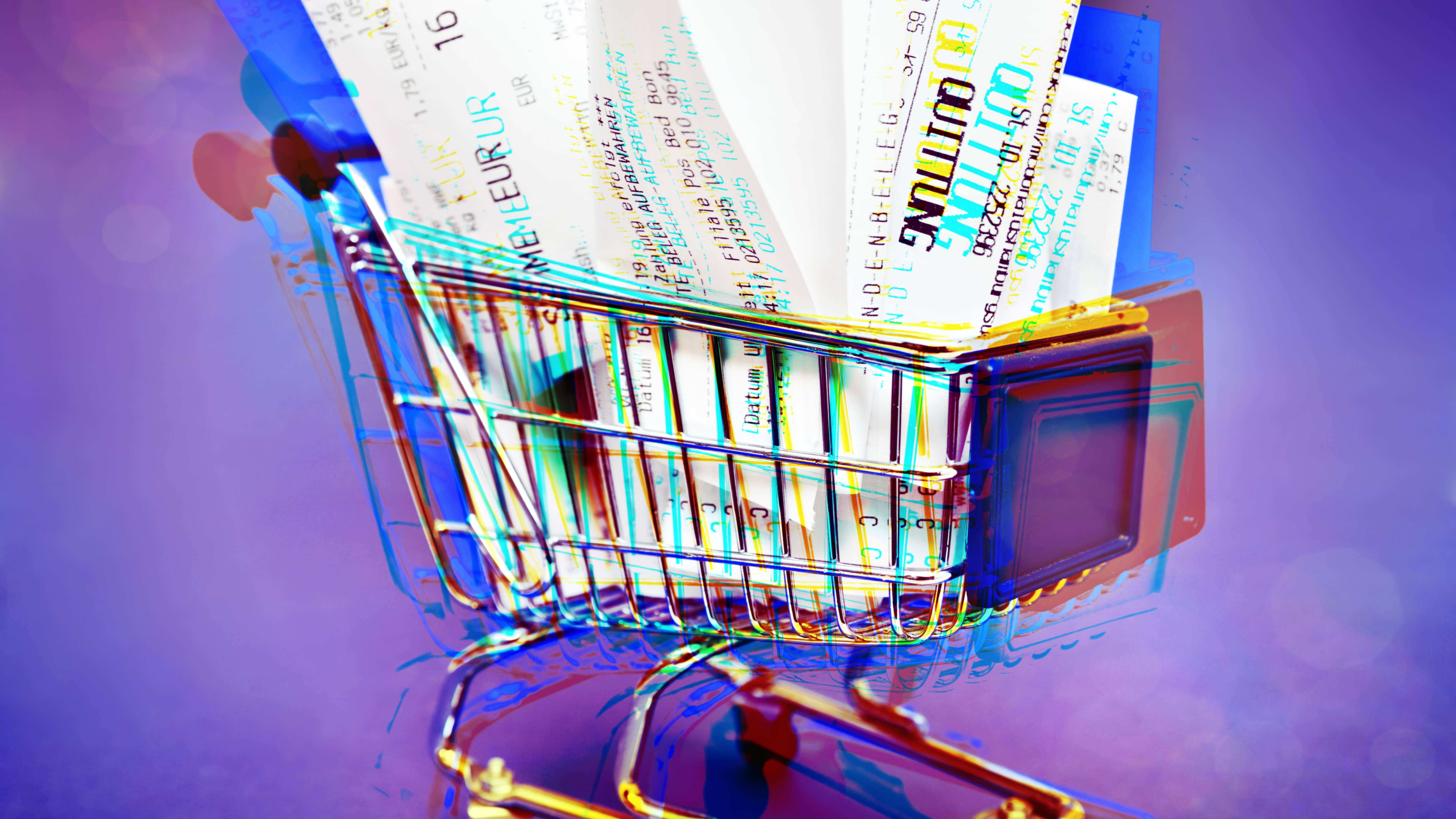 Ein Einkaufswagen voll mit Kassenzetteln, mittels dere die Statistikbehörde Daten der Bürger:innen sammeln will