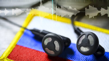 Headphones on Russia flag with audio track, symbolic photo Taurus wiretapping affair