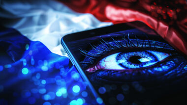 Prompt: a smartphone with chat on screen, in the background a big surveillance eye and the flag of France, illustration, dark, --ar 16:9