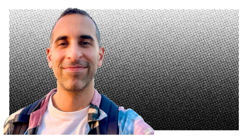 a man in front of grey pixelated grey background.