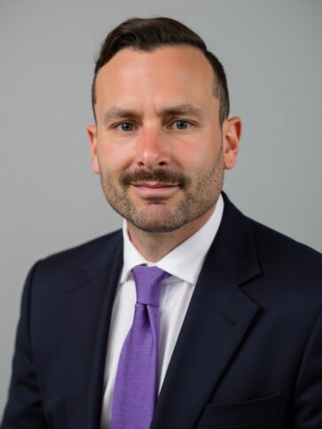 Man in suit with mustache