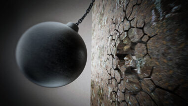 Eine Illustration mit einer schwarzen Abrissbirne, die auf eine Wand zuschwingt