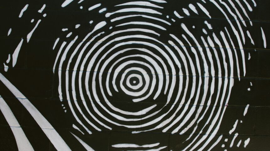 Ein schwarz-weiß Bild, das ein Gesicht zeigt, das wie ein Fingerabdruck gemalt ist.