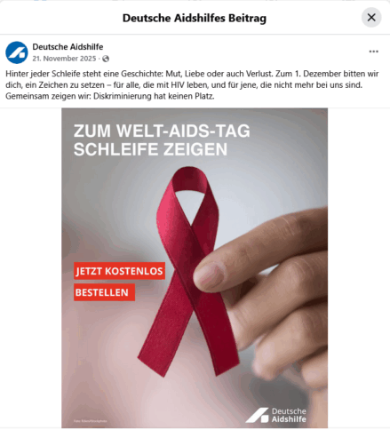 Eine Werbeanzeige auf Facebook mit einer einer Hand, die eine rote Schleife hält. Darauf der Schriftzug: Zum Welt-Aids-Tag Schleife zeigen